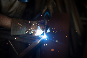 Steel welding. Metal seam welding. High temperature blue. Metal work.