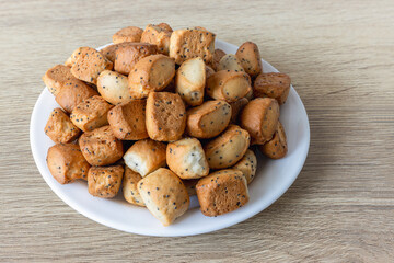 Kuciukai are traditional Lithuanian Christmas cookies or chips on a plate