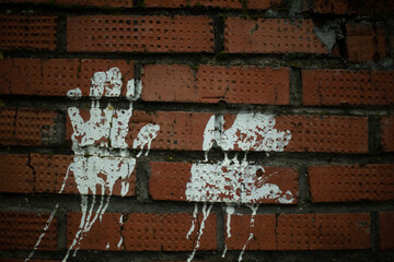 Handprint paint. Imprint on brick wall. White paint silhouette of palm. Finger mark on wall.