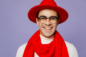 Close up young fun trendy designer happy middle eastern man 20s he wear white turtleneck red hat scarf glasses look camera isolated on plain pastel light purple background. People lifestyle concept. - Powered by Adobe