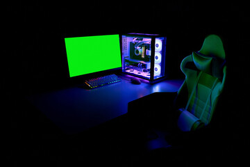 Gaming PC with RGB light, keyboard, mouse, gaming chair and monitor with green screen, copy space....