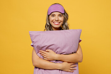 Calm young smiling happy woman she wears purple pyjamas jam sleep eye mask rest relax at home hold...