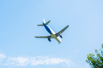 Travel by air transport. Airplane landing. Airplane in the sky.