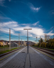 Fototapeta na wymiar Steyregg station with dark blue sky and platform in autumn evening