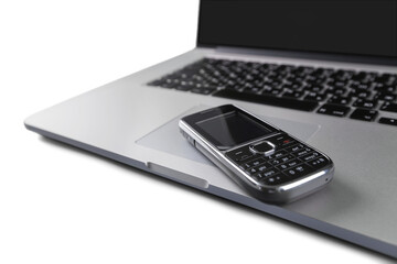 Obraz premium Laptop with blank screen and phone . Isolated background