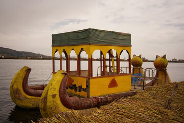 Traditional boat of Uros tribe in lake Titicaca in Peru