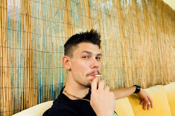 Beautiful man with a cigarette