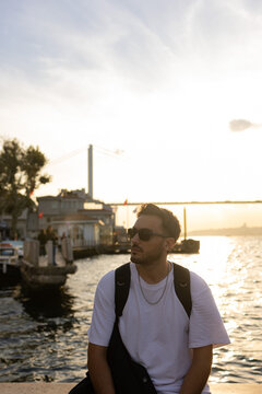 A man posing on bosphorus bridge. Istanbul, Turkey.
