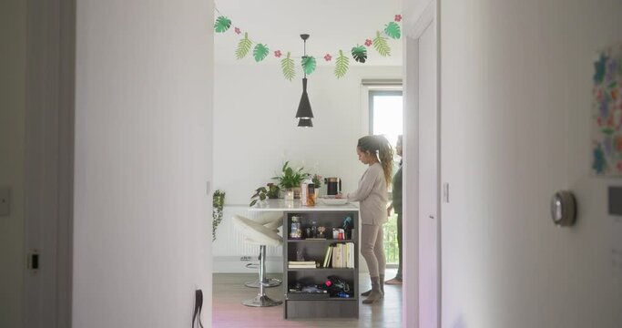 Women preparing breakfast in kitchen