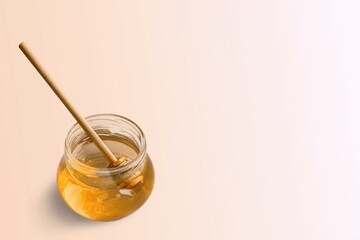 Fresh sweet organic honey in glass jar