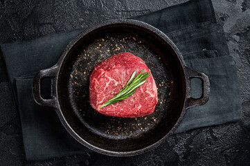 Prime Fillet Mignon Beef steak ready for cooking, Dry aged raw tenderloin meat. Black background....
