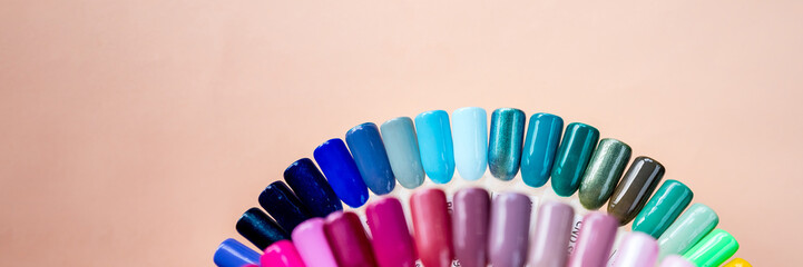 Nail polish samples in different bright colors. Colorful nail lacquer manicure swatches. Top view...