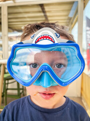 Portrait of boy wearing swimming goggles