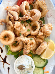Fried calamari rings served in plate
