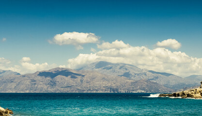 Scenic view of seascape and snowcapped mountain