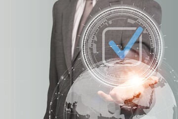 Happy young business man pointing with finger