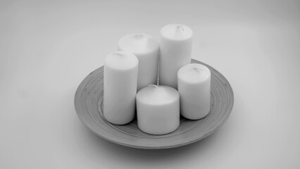 Cylinder candles black and white on an isolated background 