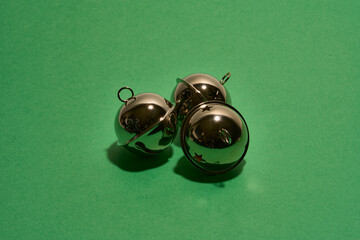 Christmas bells isolated on green 