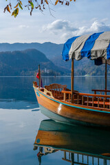 Fototapeta na wymiar Lake BLed Boat with Reflection