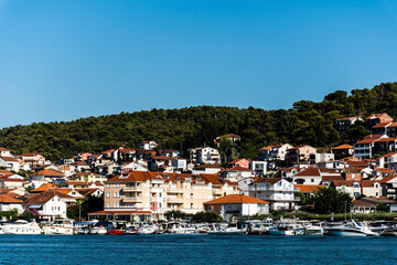 Fototapeta na wymiar Landscape with the buildings seen from the promenade of the old town of Trogir. Croatia.