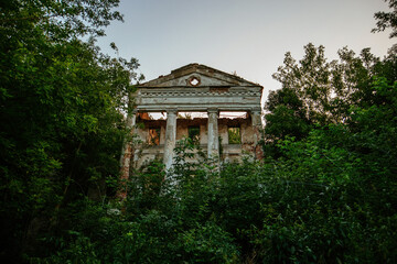 Old ruins of abandoned mansion overgrown by plants. Former Verevkin manor, Kursk region