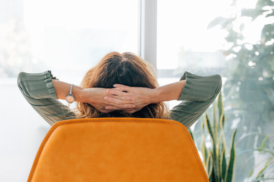 woman at home resting relaxed on the sofa