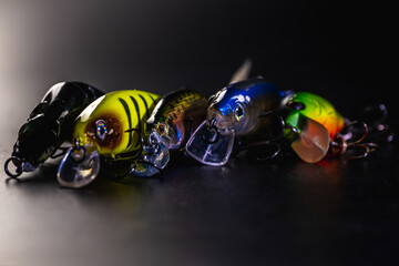 Lures for fishing on a black background