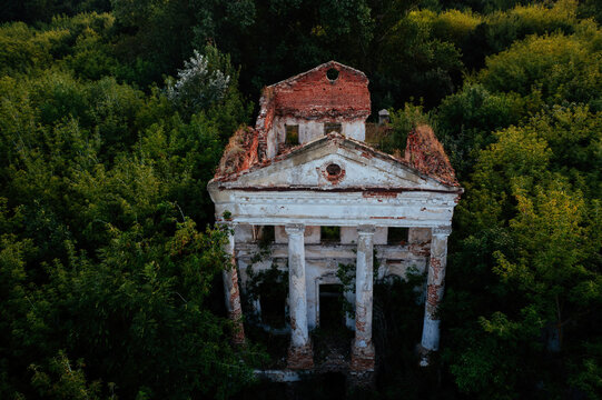 Old ruins of abandoned mansion overgrown by plants, aerial view. Former Verevkin manor, Kursk region
