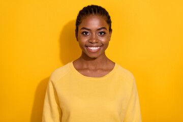 Portrait of attractive cheerful glad brunette friendly girl wearing casual isolated over vibrant yellow color background