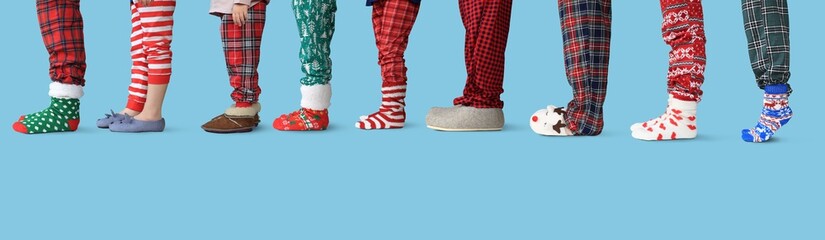Christmas. A large family all together in pajamas and slippers is standing in line for gifts.