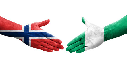 Handshake between Nigeria and Norway flags painted on hands, isolated transparent image.