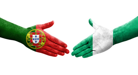 Handshake between Nigeria and Portugal flags painted on hands, isolated transparent image.