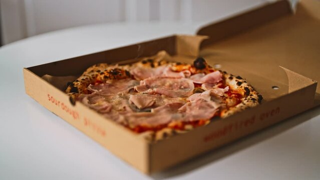 Pizza capricciosa. Pizza with ham, mushrooms and artichokes.