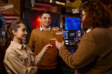 Happy diverse friends group making toast with beer