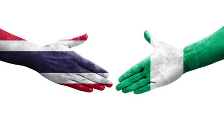 Handshake between Nigeria and Thailand flags painted on hands, isolated transparent image.