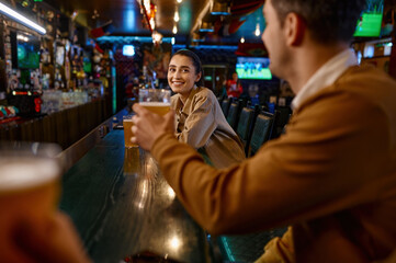 Man offering pretty woman to clink glasses