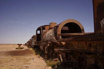 Fototapeta na wymiar Old rusty train wrecks in desert Bolivia