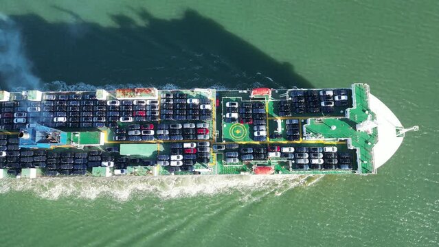 Vessels for transporting cars and ro-ro boats. View from above. The ship delivers new cars