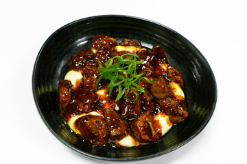 bbq glazed pepper beef with mashed potatoes in a bowl