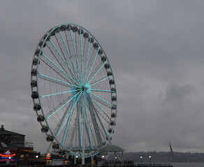 The Seattle ferris wheel during a chilly rainy day in the fall.