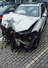 Total accident of a white car after hitting a lamppost. Frontal collision. Deployed airbags during rescues.