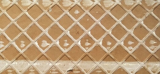 Reverse side of ceramic tiles. Detailed texture of tiles. Lattice surface closeup.