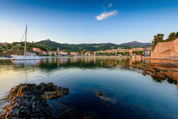 Collioure harbor and medieval castle at sunrise in France