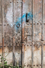 Close-up of very old timeworn wooden door 