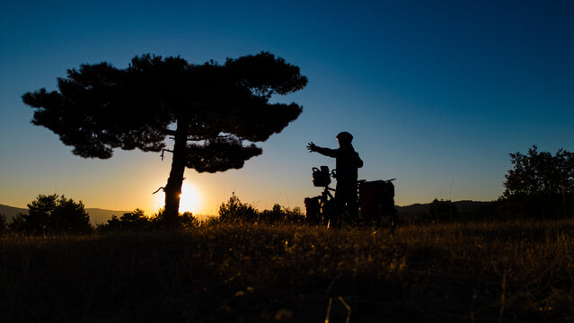cyclist traveler making a photographic memory in unusual places by taking a long tour
