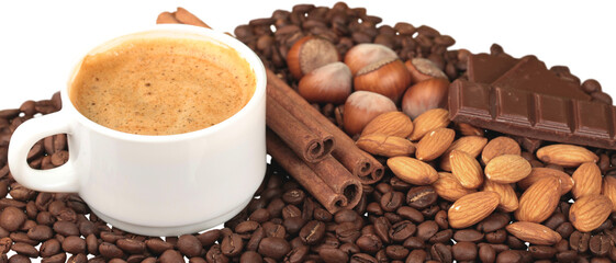 Cup of hot coffee with beans and cinnamon sticks on white background