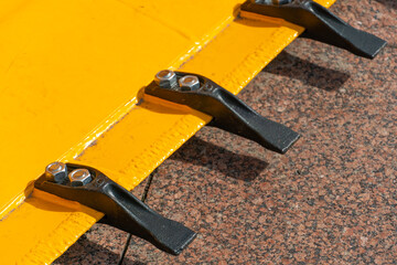 A large yellow construction excavator on a construction site. A new quarry bulldozer for the...