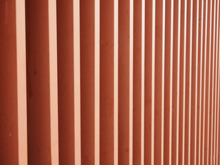 The side of a modern red building.