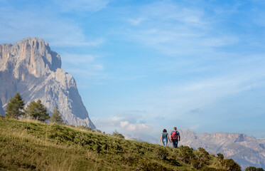 Fototapeta premium Hikers hiking in Alpe di Siusi - Seiser Alm