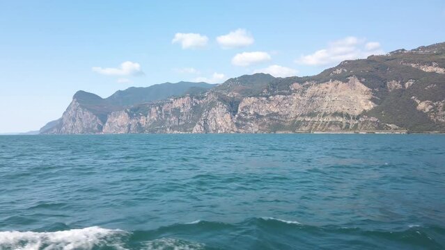 Sailing towards Malcesine in Garda lake in Italy